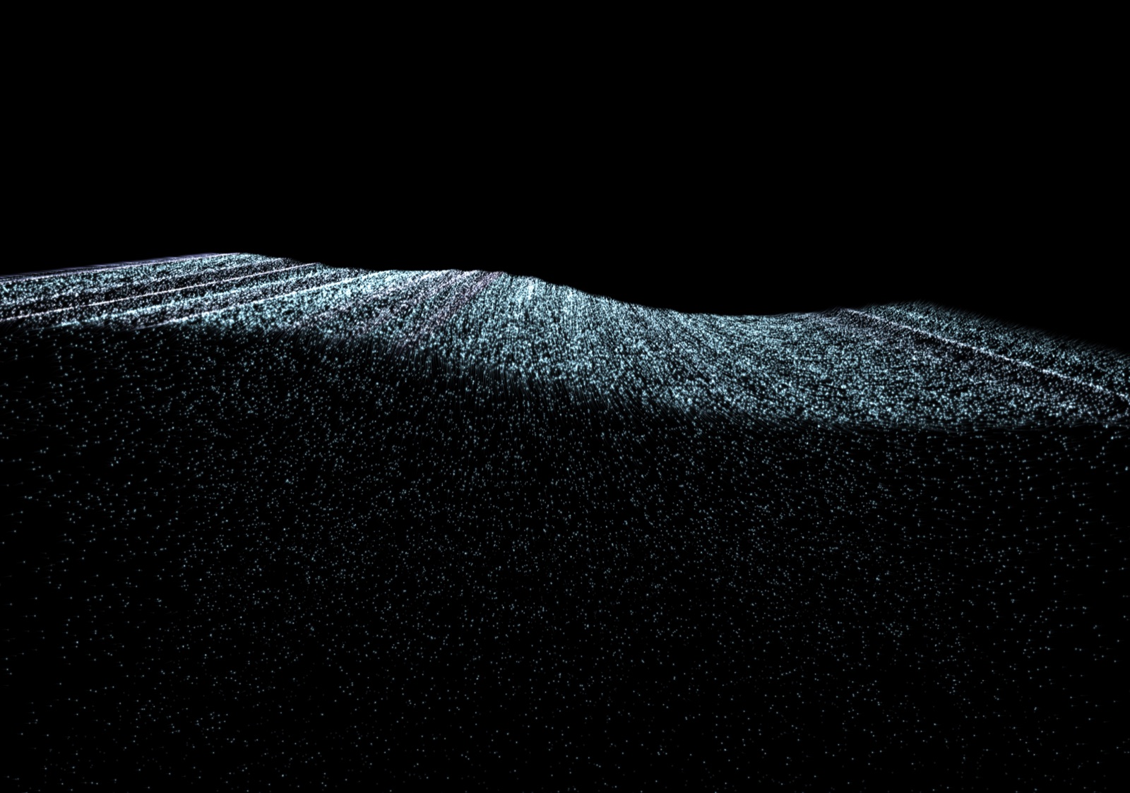 A dark, rolling open sea of pale particles with faint white streaks along the crests.